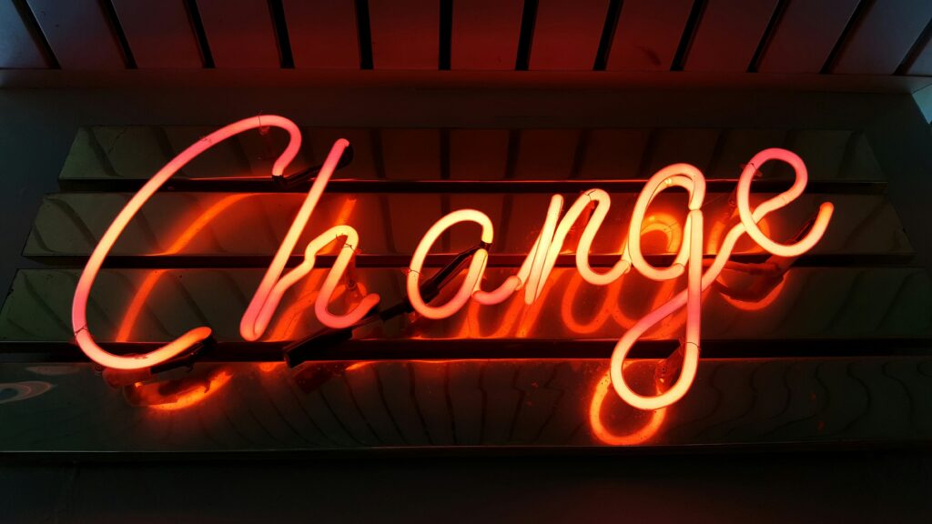 Orange neon Change sign.